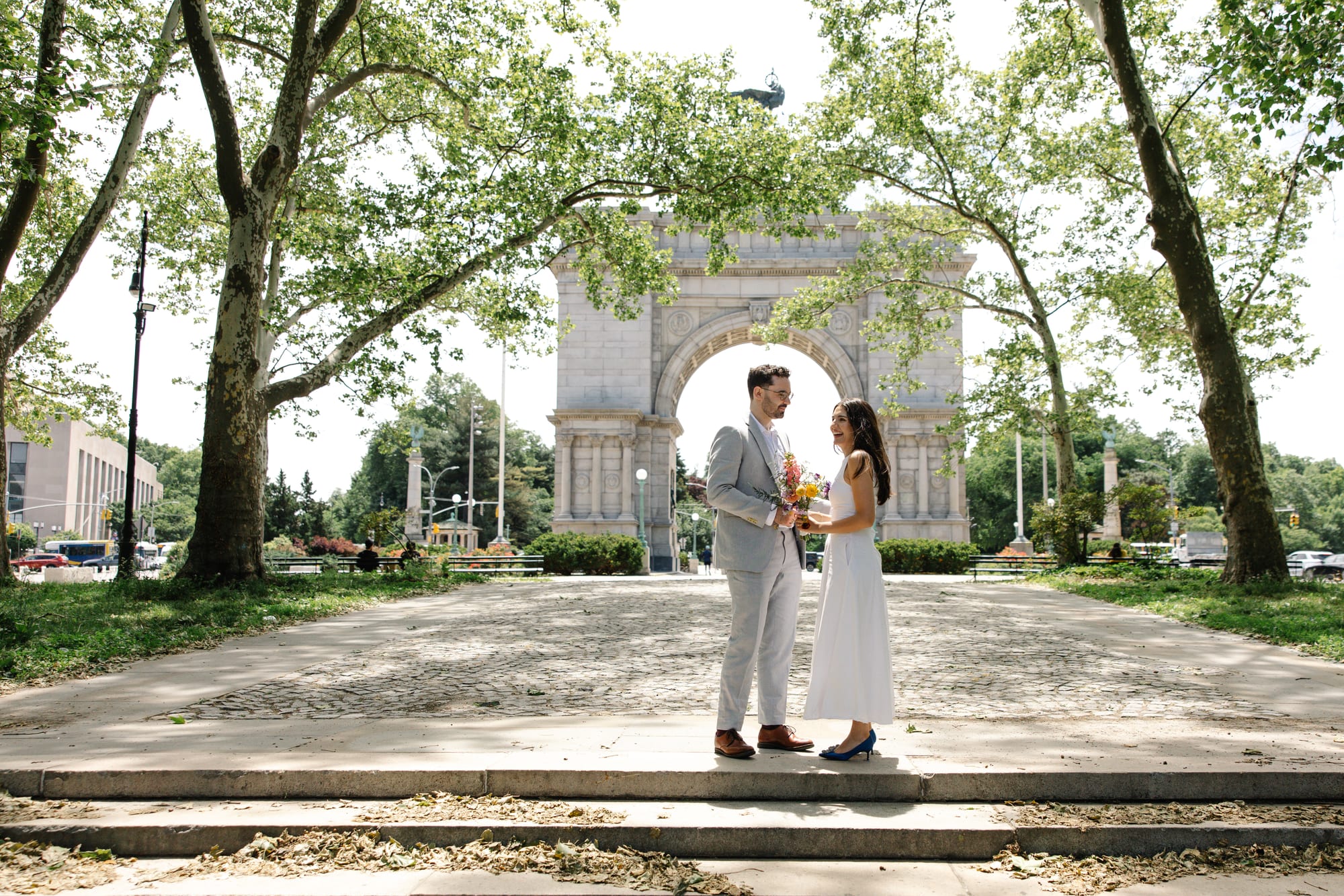 Katherine and Liam beneath the arch at Grand Army Plaza in Brooklyn